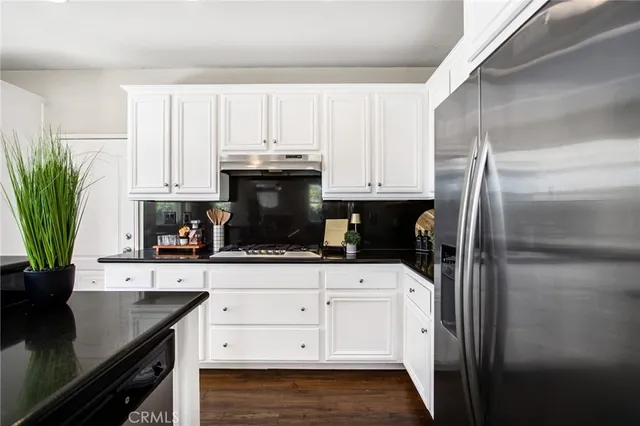 a view of entryway with wooden floor and stairs