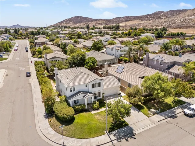 an aerial view of a house with a lake view