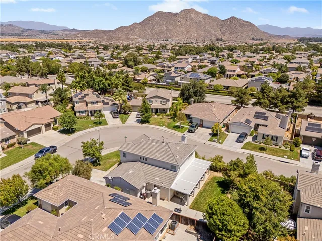an aerial view of lake and residential houses with outdoor space