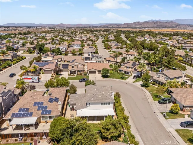 an aerial view of a house with a lake view