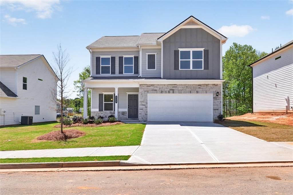 725 Sinclair Lane Temple, GA 30179 - Photo 1 of 1 a front view of a house with a yard and garage