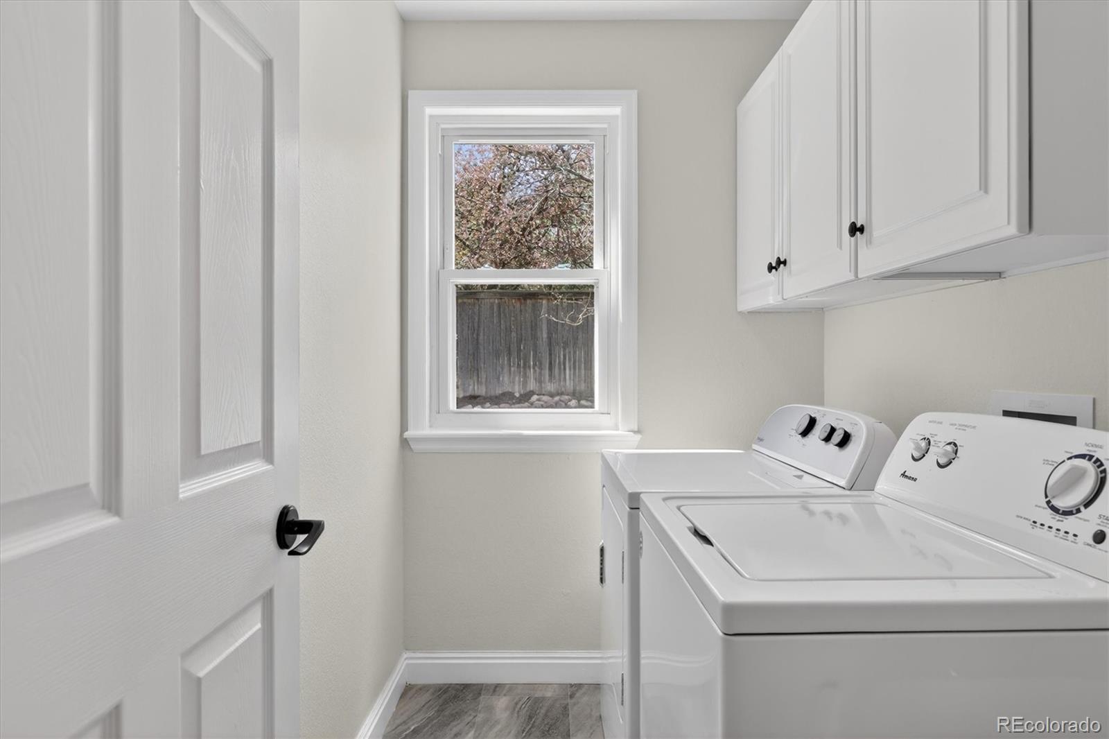 2445 East Lansdowne Court Highlands Ranch, CO 80126 - Photo 22 of 49 a view of utility room with washer and dryer