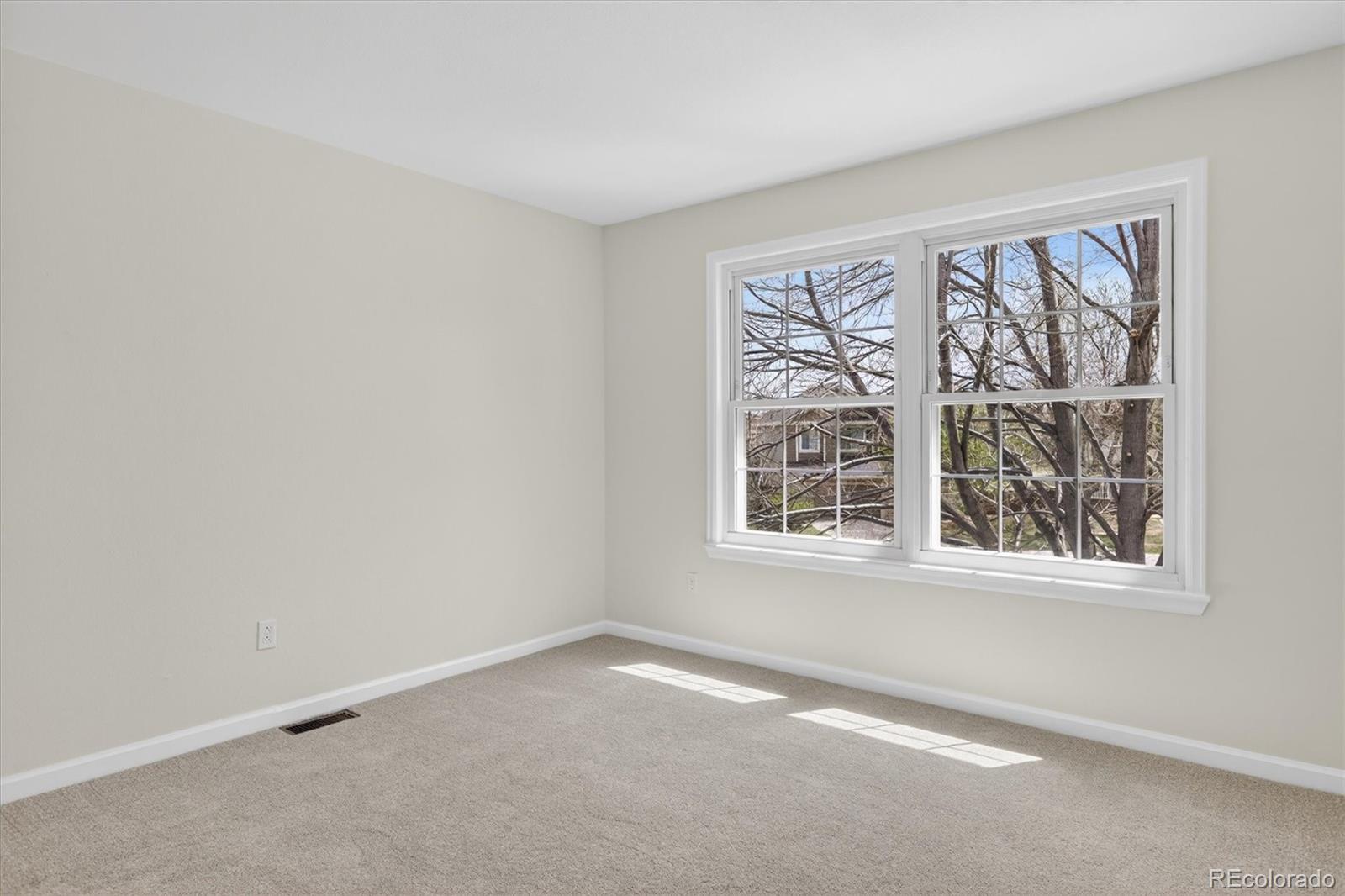 2445 East Lansdowne Court Highlands Ranch, CO 80126 - Photo 29 of 49 an empty room with a window