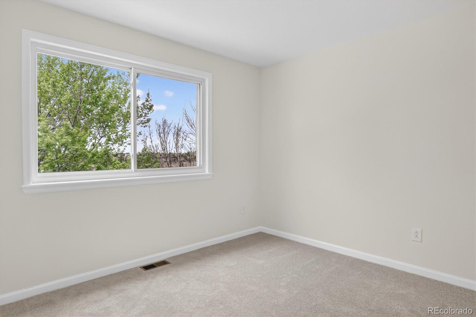 2445 East Lansdowne Court Highlands Ranch, CO 80126 - Photo 32 of 49 an empty room with a window