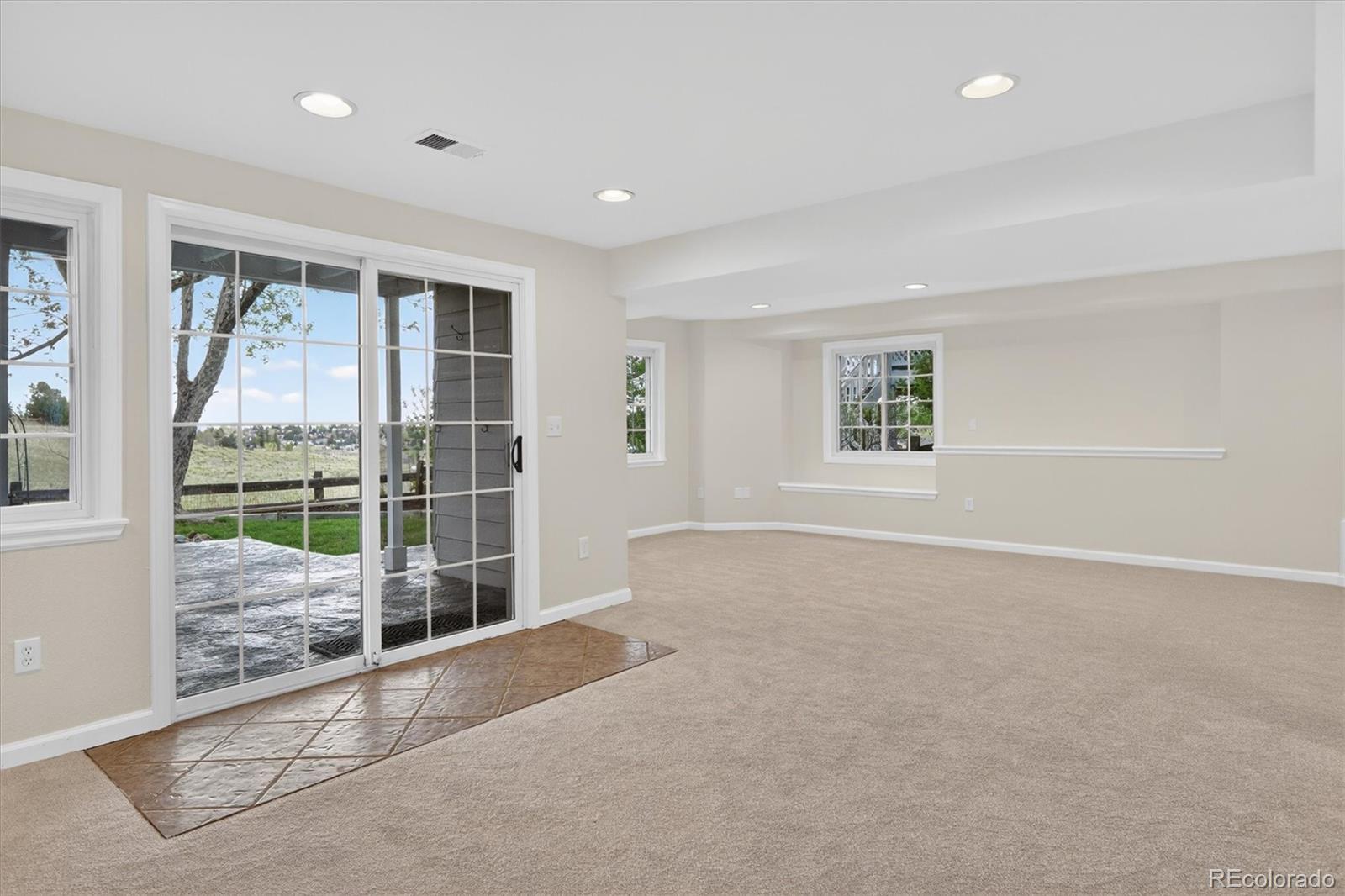 2445 East Lansdowne Court Highlands Ranch, CO 80126 - Photo 35 of 49 a view of an empty room with windows