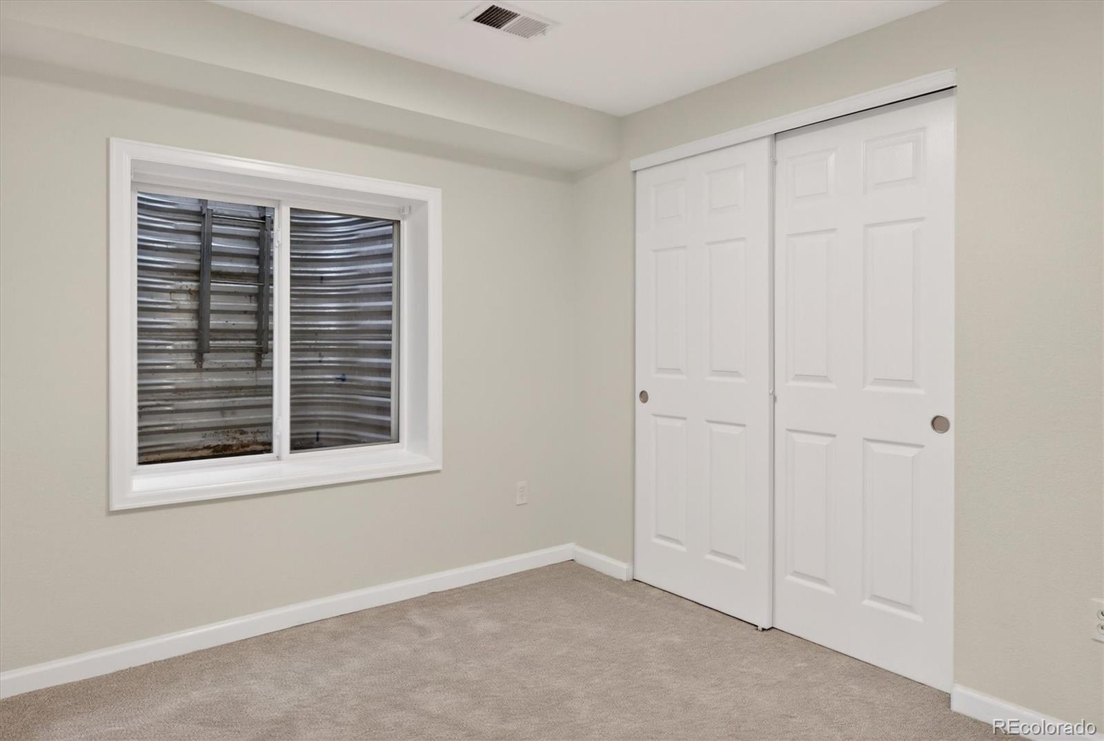 2445 East Lansdowne Court Highlands Ranch, CO 80126 - Photo 38 of 49 a view of an empty room with a window