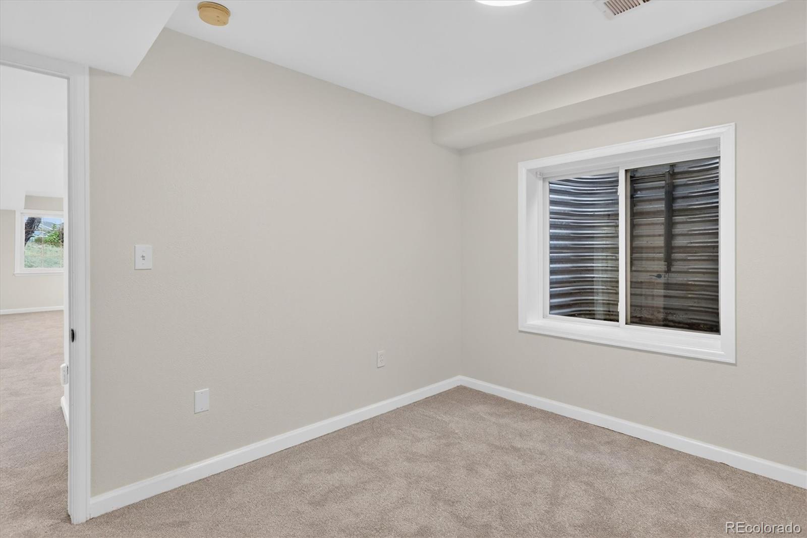 2445 East Lansdowne Court Highlands Ranch, CO 80126 - Photo 39 of 49 an empty room with a window