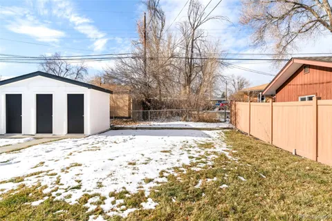 a outside view of a house with a snow in the background