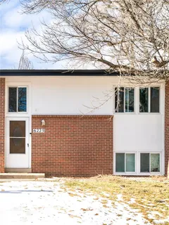 a view of a house with a snow on the road