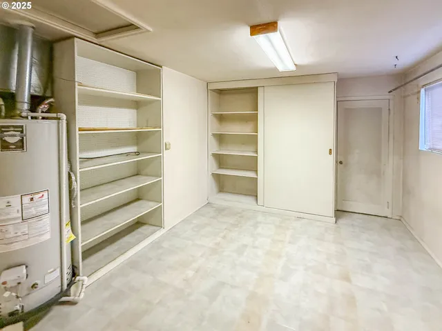 a view of an empty room with a closet
