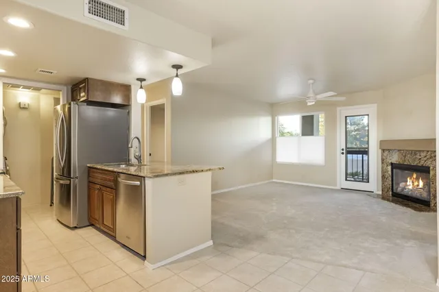a living room with furniture and a fireplace