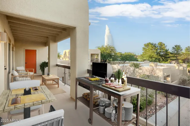 a kitchen with stainless steel appliances granite countertop a refrigerator and a stove