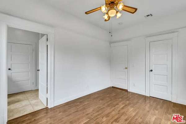 a kitchen with granite countertop cabinets stainless steel appliances and a sink