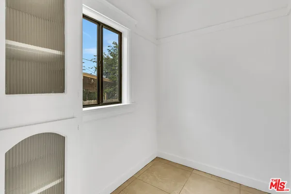 a view of a hallway with washer and dryer