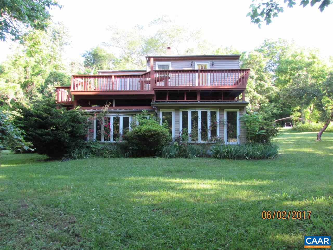 668 Peters Hollow Road Monroe, VA 24574 - Photo 16 of 50 a view of a house with a yard and potted plants
