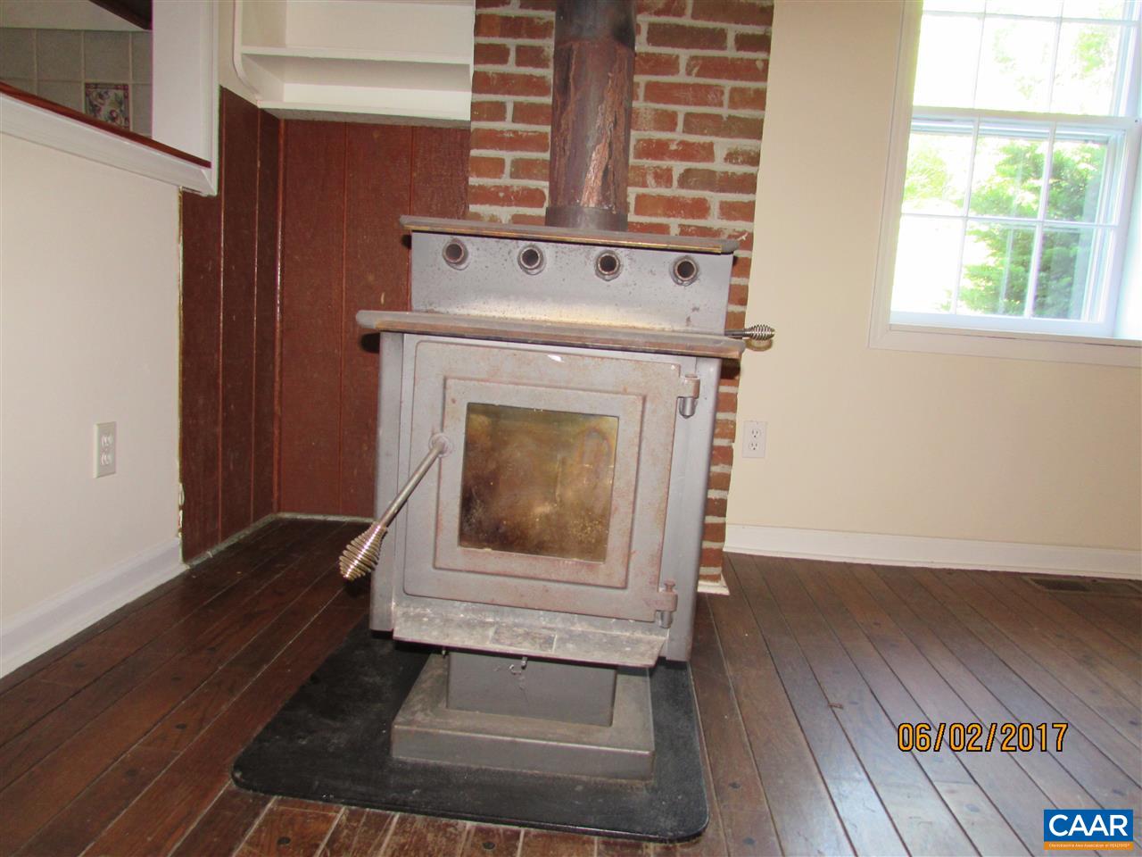 668 Peters Hollow Road Monroe, VA 24574 - Photo 30 of 50 a stove top oven sitting inside of a kitchen