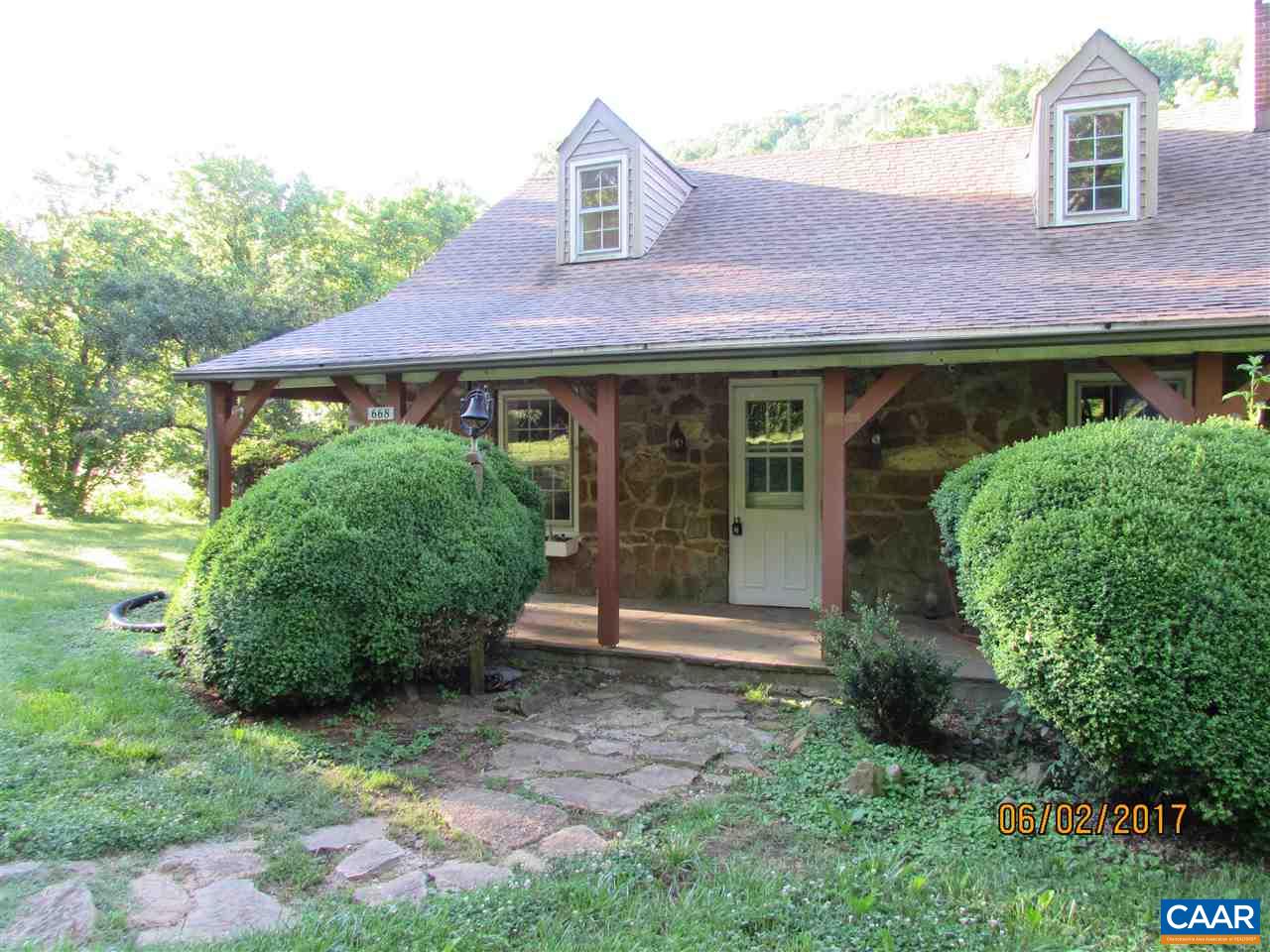 668 Peters Hollow Road Monroe, VA 24574 - Photo 3 of 50 a front view of a house with garden