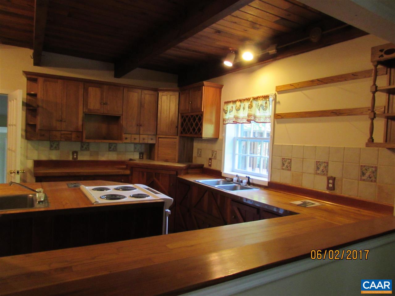 668 Peters Hollow Road Monroe, VA 24574 - Photo 32 of 50 a kitchen with a sink and a stove top oven