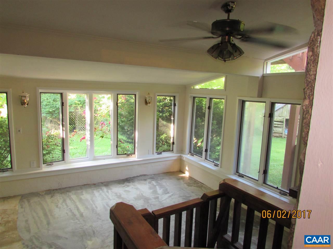 668 Peters Hollow Road Monroe, VA 24574 - Photo 36 of 50 a view of a livingroom with a ceiling fan and a large window