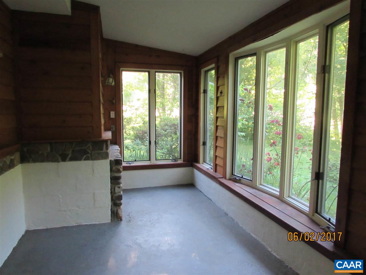 668 Peters Hollow Road Monroe, VA 24574 - Photo 37 of 50 a view of room with window and floor to ceiling window