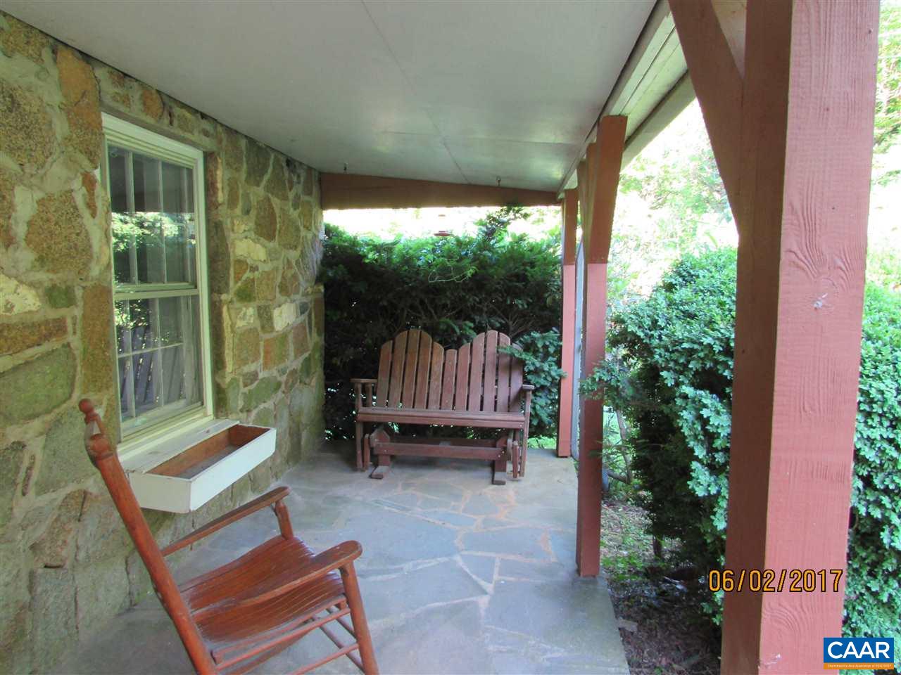 668 Peters Hollow Road Monroe, VA 24574 - Photo 8 of 50 a balcony with furniture and a potted plant