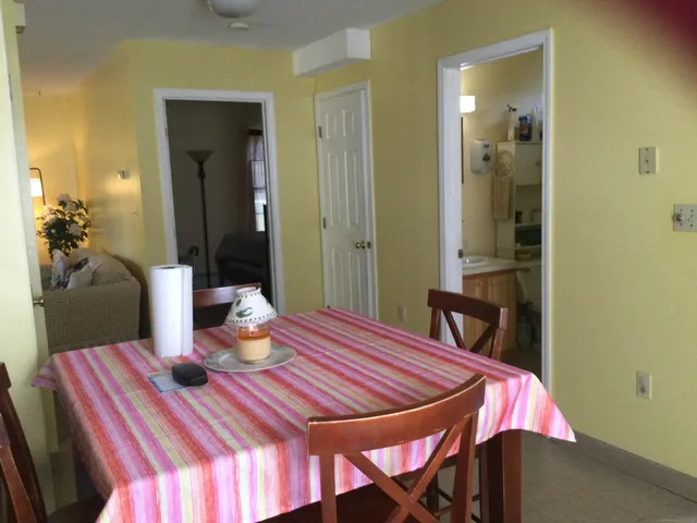 a bedroom with a bed and a table