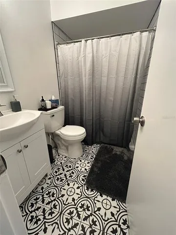 a bathroom with a sink and a toilet