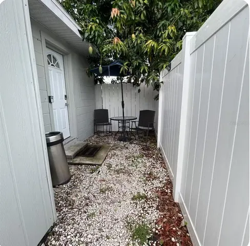 a view of a back yard of the house