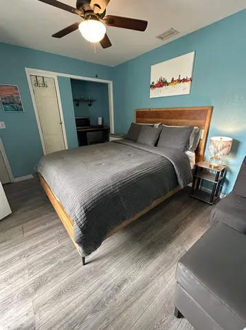 a bedroom with bed and window