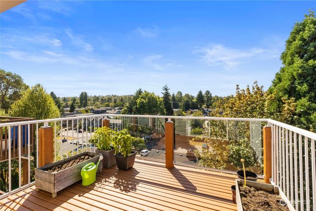 a view of a balcony with wooden floor