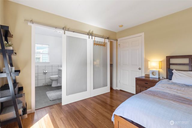 a bedroom with a bed and a walk in closet