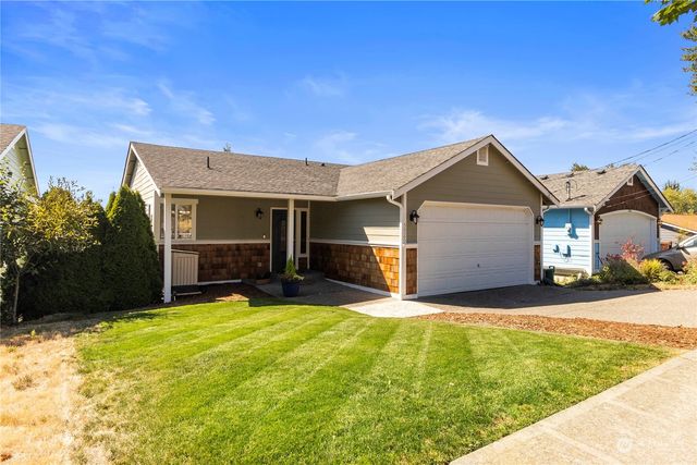 a front view of a house with a yard