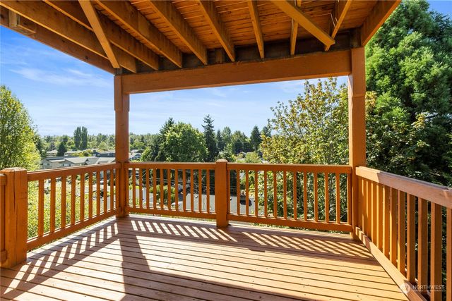 a view of a balcony with wooden floor