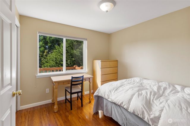 a bedroom with a bed and a table in it