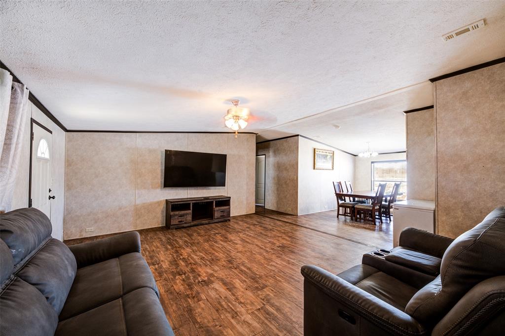 1420 County Road 4522 Decatur, TX 76234 - Photo 11 of 24 a living room with furniture and a flat screen tv