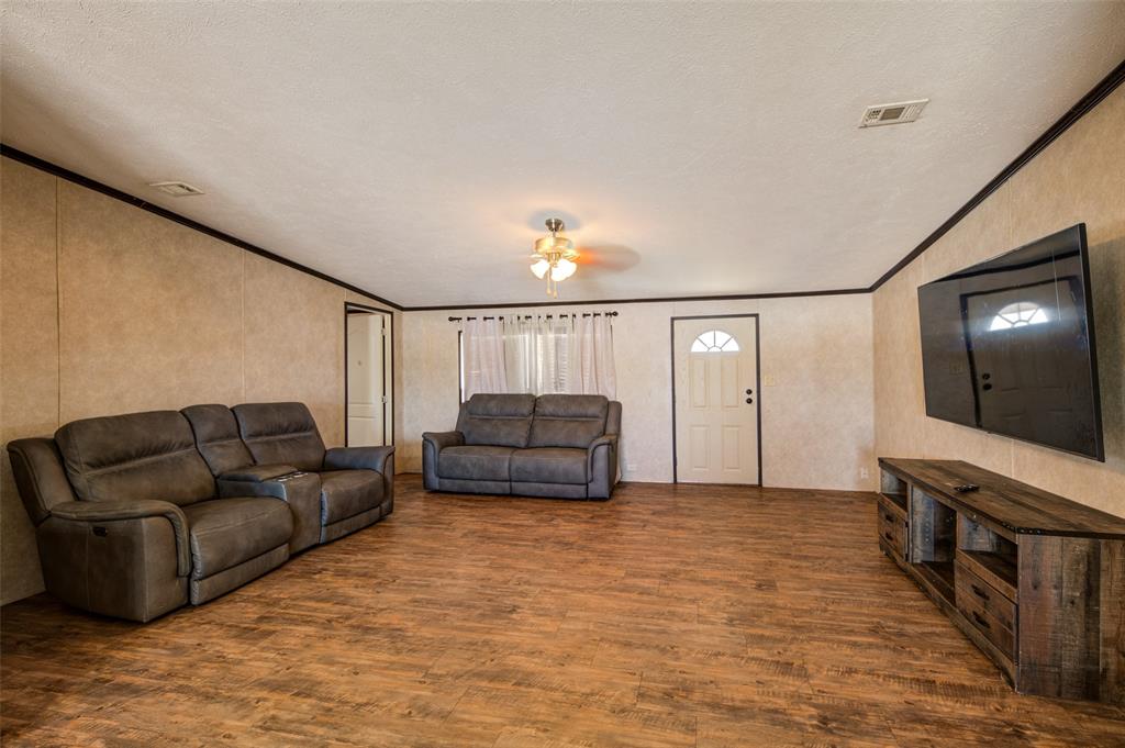 1420 County Road 4522 Decatur, TX 76234 - Photo 16 of 24 a living room with furniture and a flat screen tv