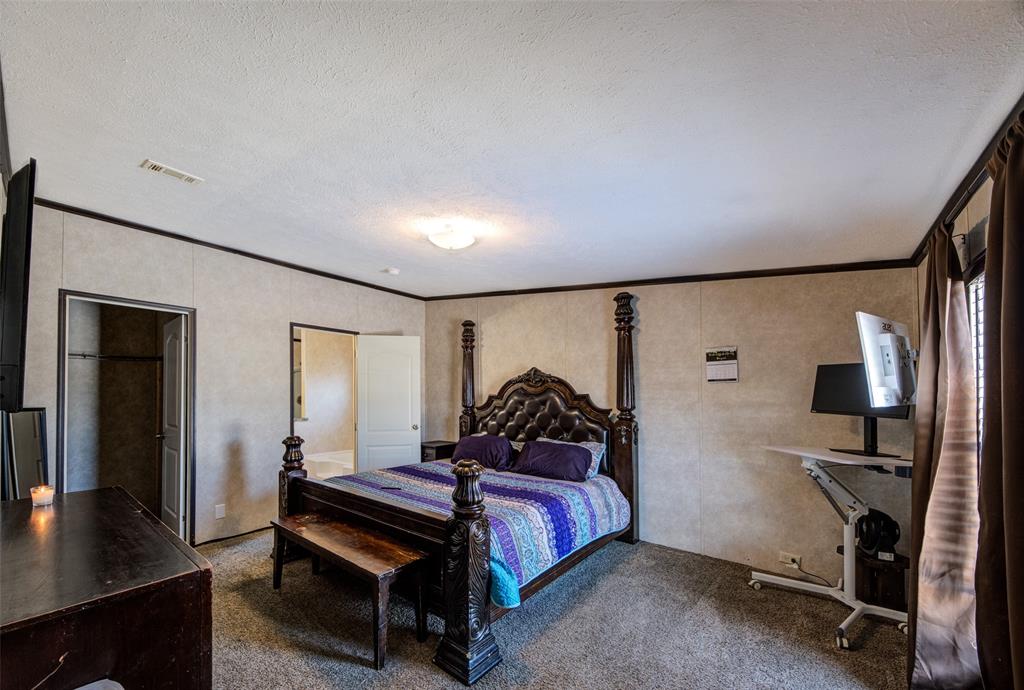 1420 County Road 4522 Decatur, TX 76234 - Photo 17 of 24 a bedroom with a bed a desk and chair