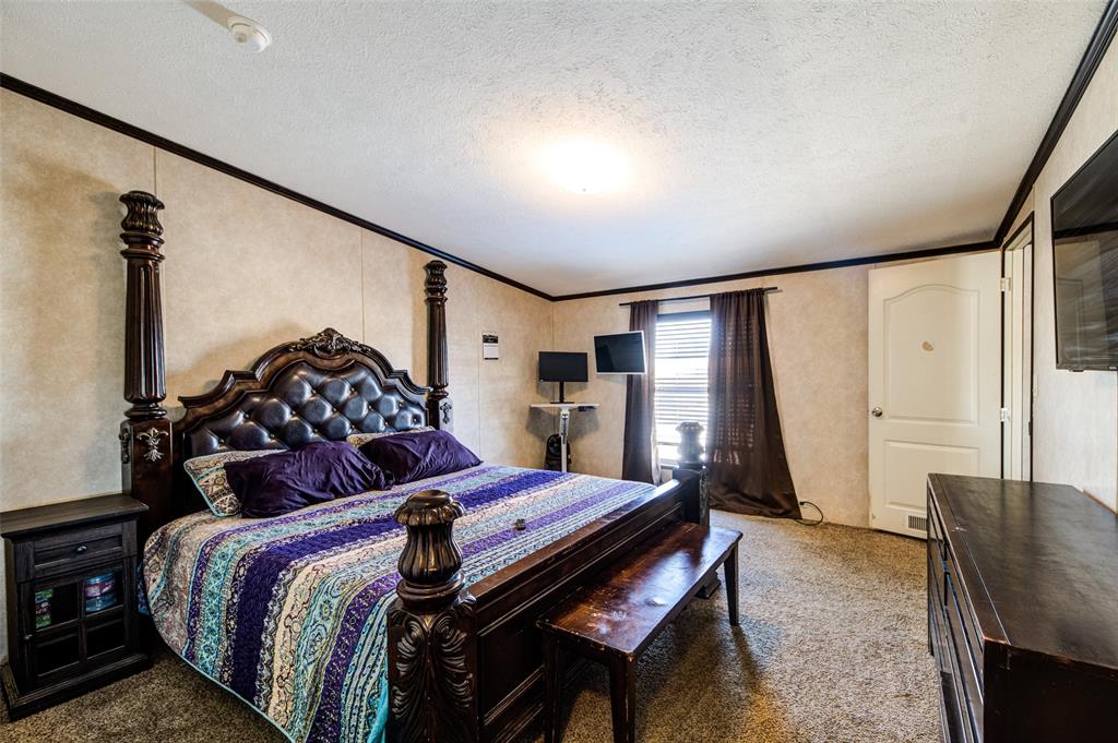 1420 County Road 4522 Decatur, TX 76234 - Photo 19 of 24 a bed room with a bed chair and a window