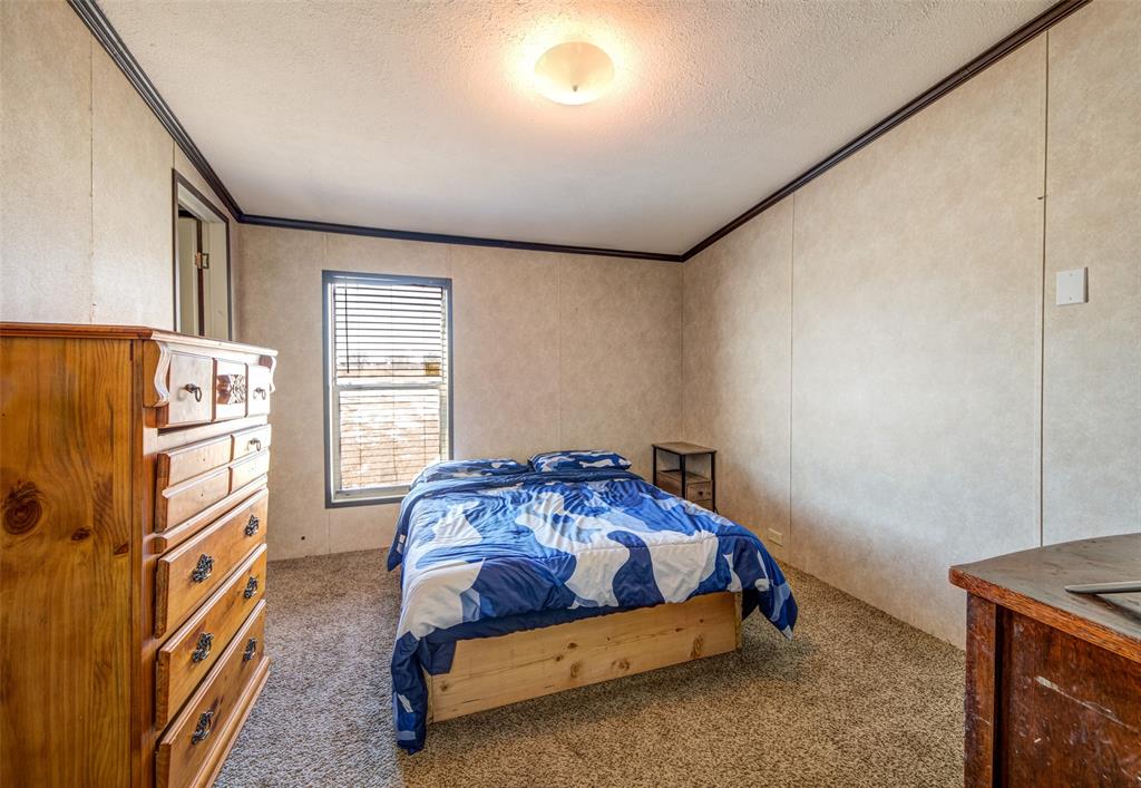 1420 County Road 4522 Decatur, TX 76234 - Photo 20 of 24 a bedroom with a bed and window