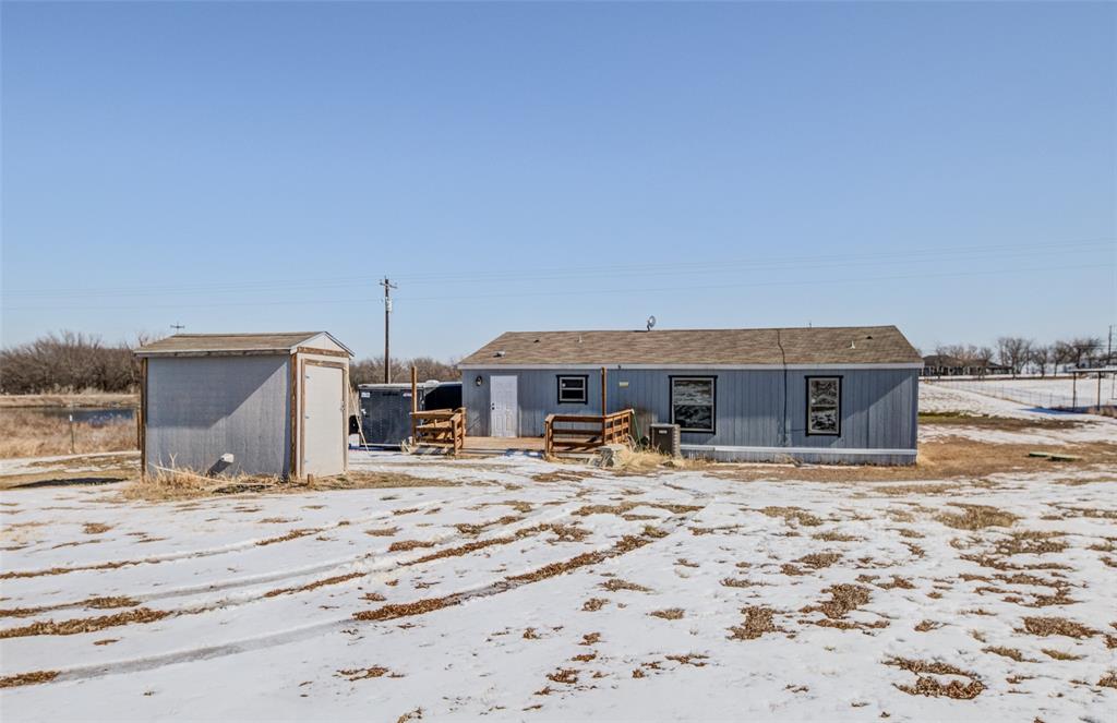 1420 County Road 4522 Decatur, TX 76234 - Photo 2 of 24 a view of a house with snow on the background