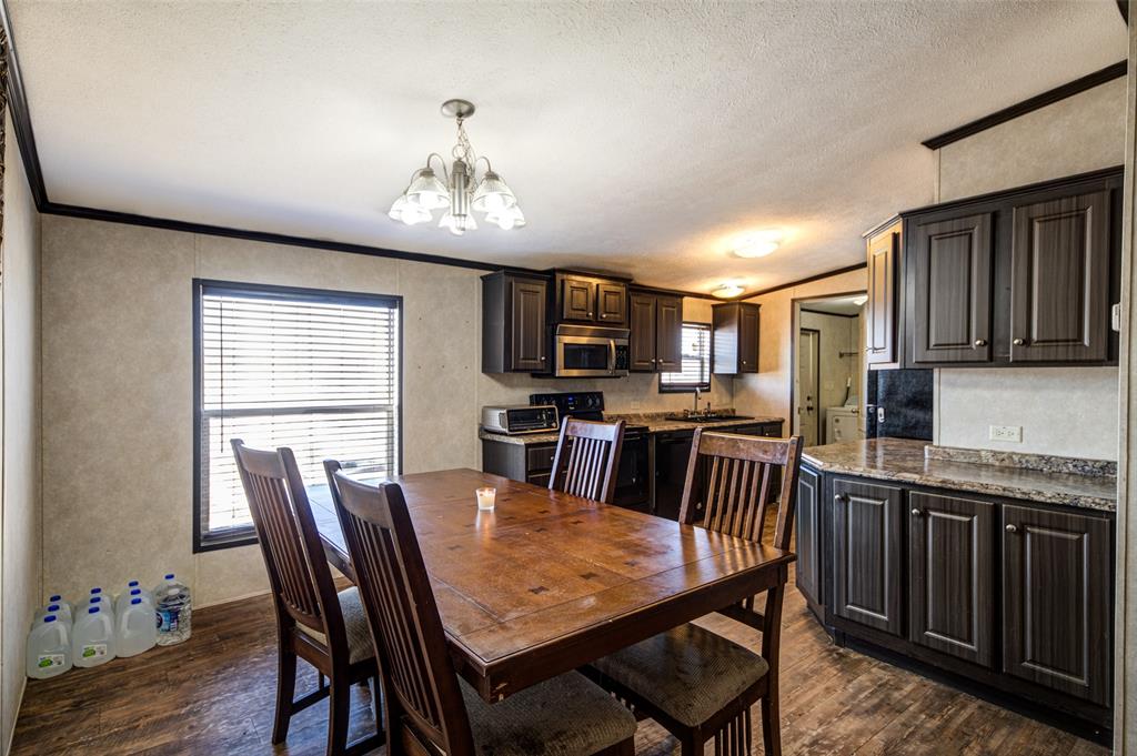 1420 County Road 4522 Decatur, TX 76234 - Photo 10 of 24 a view of a dining room with furniture kitchen and wooden floor