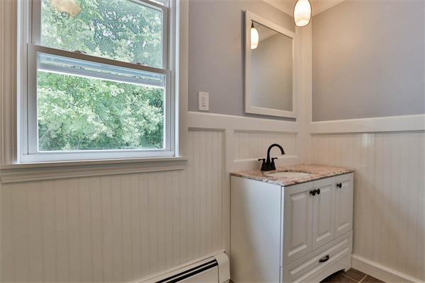 331 Pelham Street Methuen, MA 01844 - Photo 13 of 27 a view of a bathroom with a sink and a window