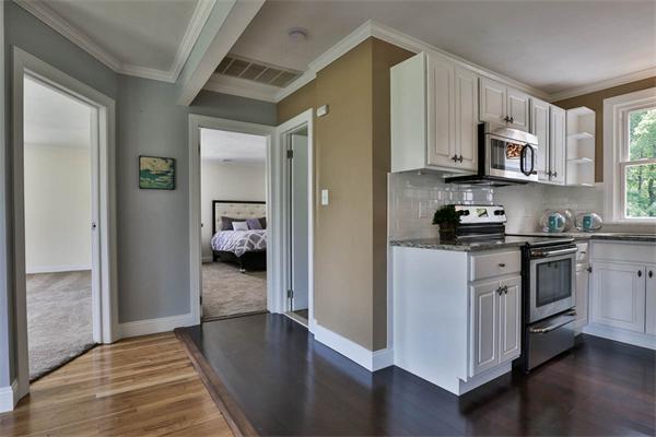 331 Pelham Street Methuen, MA 01844 - Photo 17 of 27 a kitchen with cabinets and a stove