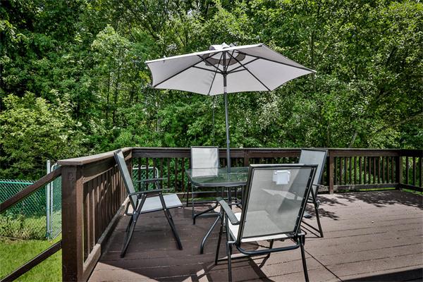 331 Pelham Street Methuen, MA 01844 - Photo 22 of 27 a view of balcony with outdoor seating and wooden floor