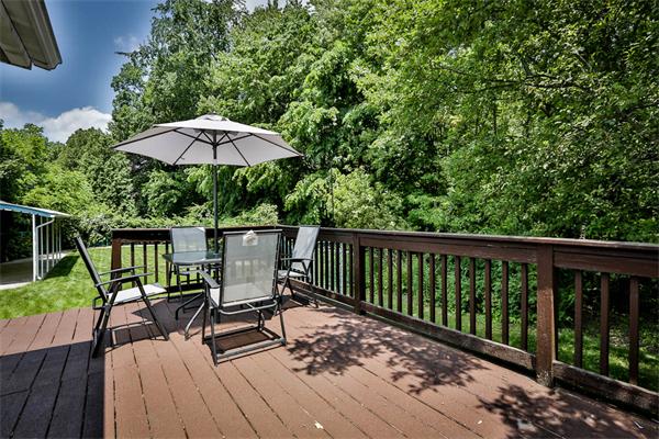 331 Pelham Street Methuen, MA 01844 - Photo 23 of 27 a view of a deck with furniture and barbeque grill with wooden floor