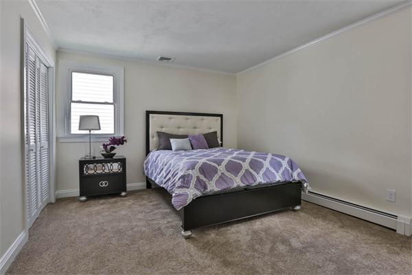 331 Pelham Street Methuen, MA 01844 - Photo 4 of 27 a bedroom with a bed and window