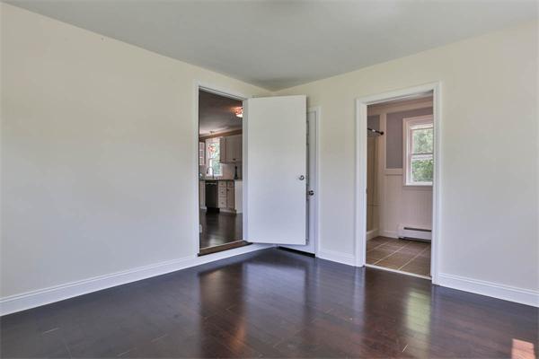 331 Pelham Street Methuen, MA 01844 - Photo 10 of 27 a view of empty room with wooden floor and bathroom