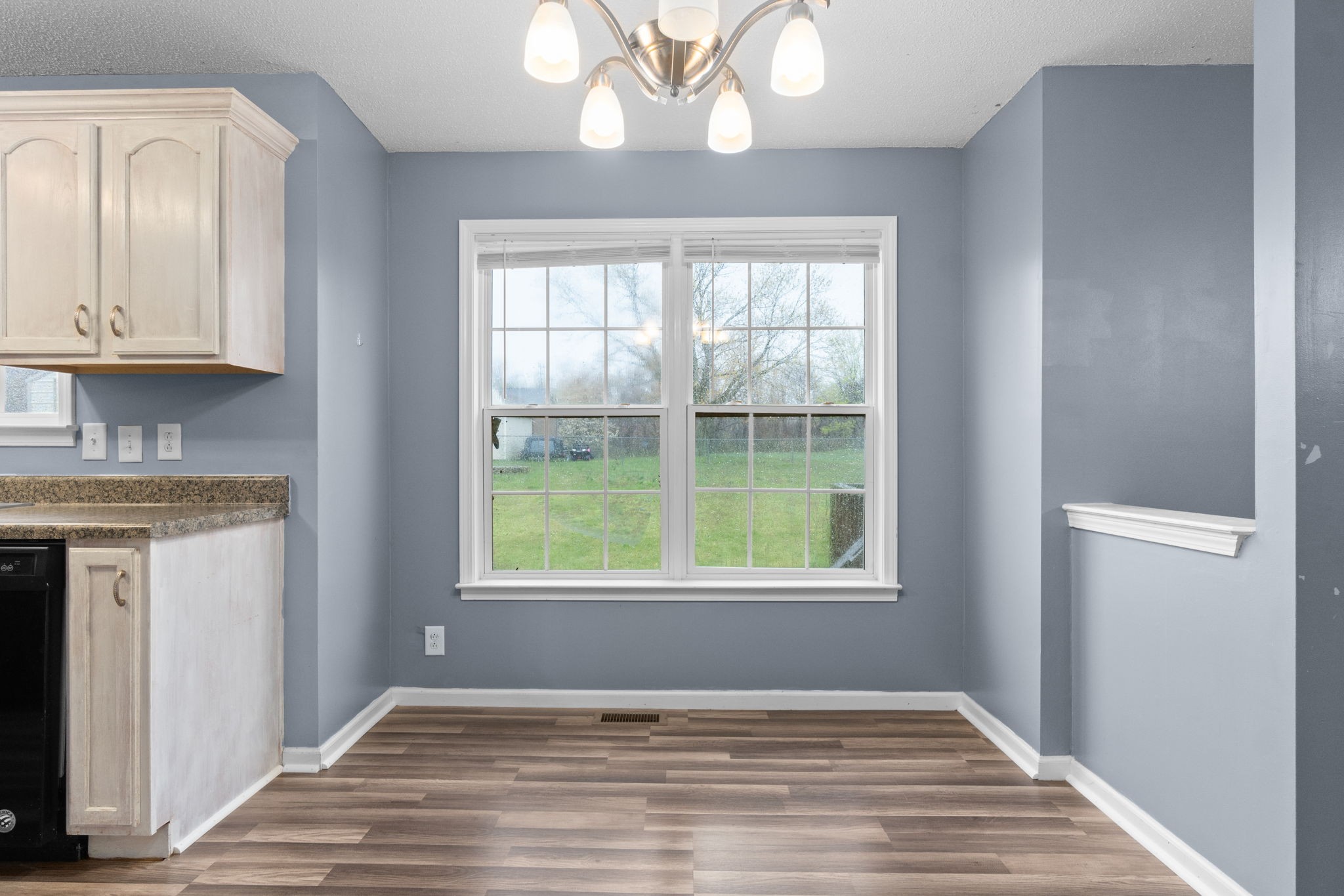 622 Avondale Road Oak Grove, KY 42262 - Photo 11 of 29 a view of an empty room with wooden floor and a window