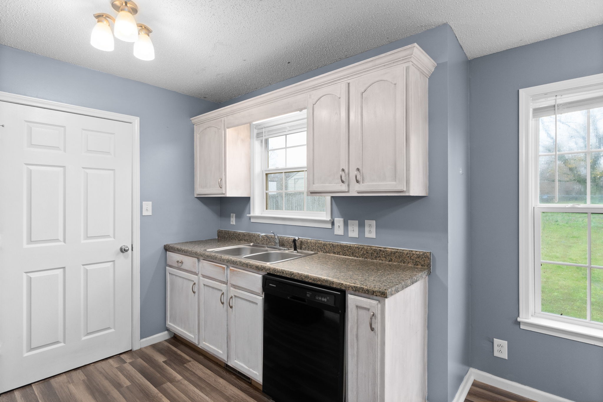622 Avondale Road Oak Grove, KY 42262 - Photo 12 of 29 a kitchen with stainless steel appliances granite countertop white cabinets and window
