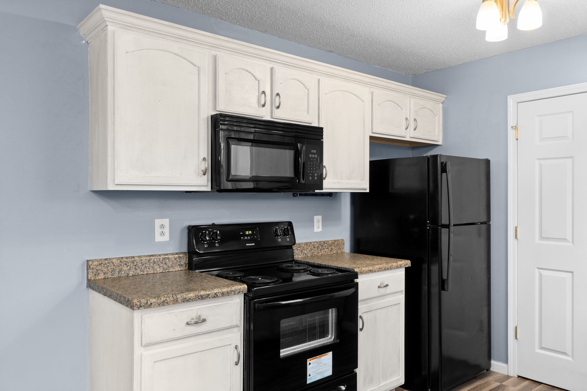 622 Avondale Road Oak Grove, KY 42262 - Photo 15 of 29 a kitchen with stainless steel appliances granite countertop white cabinets sink and a refrigerator